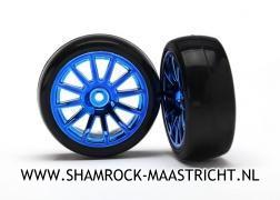 Traxxas Tires and wheels, assembled, glued (12-spoke blue chrome wheels, slick tires) (2) - TRX7573R